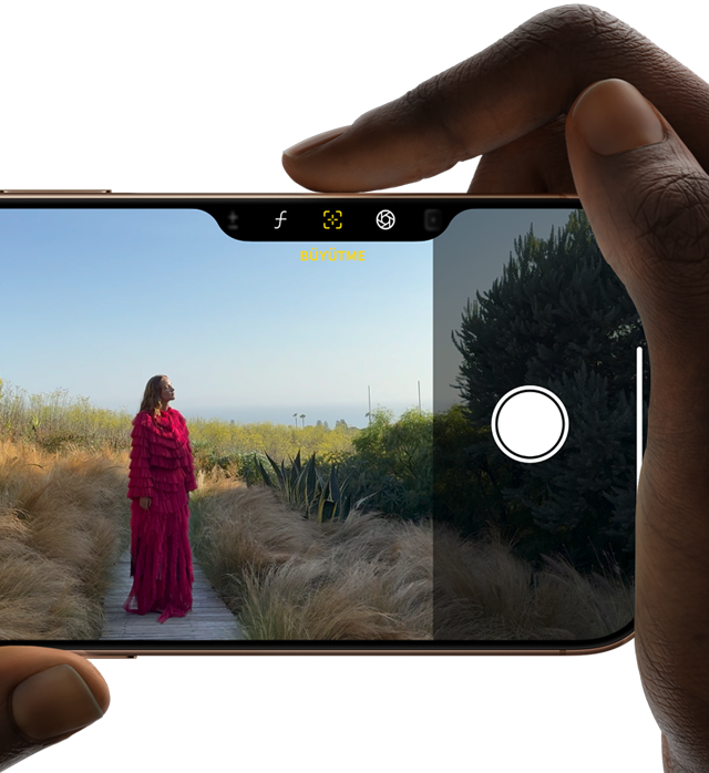 iPhone 16 Pro’daki Kamera Denetimi, alan derinliğini ayarlamak için telefonun yan tarafında kayan sağ parmak
